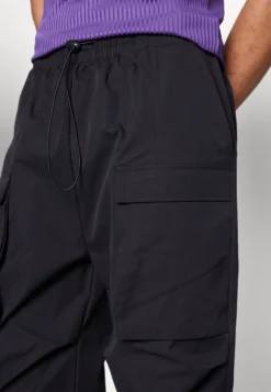 YOURTURN UNISEX - Bojówki - Black -Yourturn 12c0eb3432924e5180ee844ffb94cc93 scaled