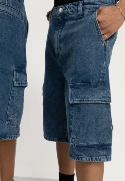 YOURTURN UNISEX - Szorty Jeansowe - Blue Denim -Yourturn 49d3adcfd05143f5958fb2586c4282e6 scaled