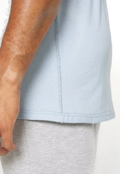 YOURTURN UNISEX - T-shirt Basic - Blue -Yourturn 513f46e078d84fd4840d407e3aa187c8 scaled