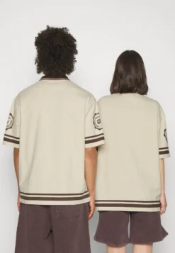 YOURTURN UNISEX - Koszulka Polo - Off-white -Yourturn b655314a0de44ac7819292d4eb2f4c5b scaled